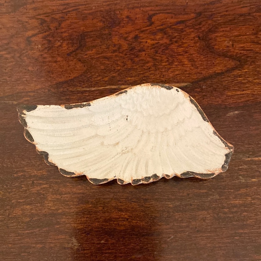 Ceramic angel wing shaped ring dish. White w/embossed feathers. Edges distressed